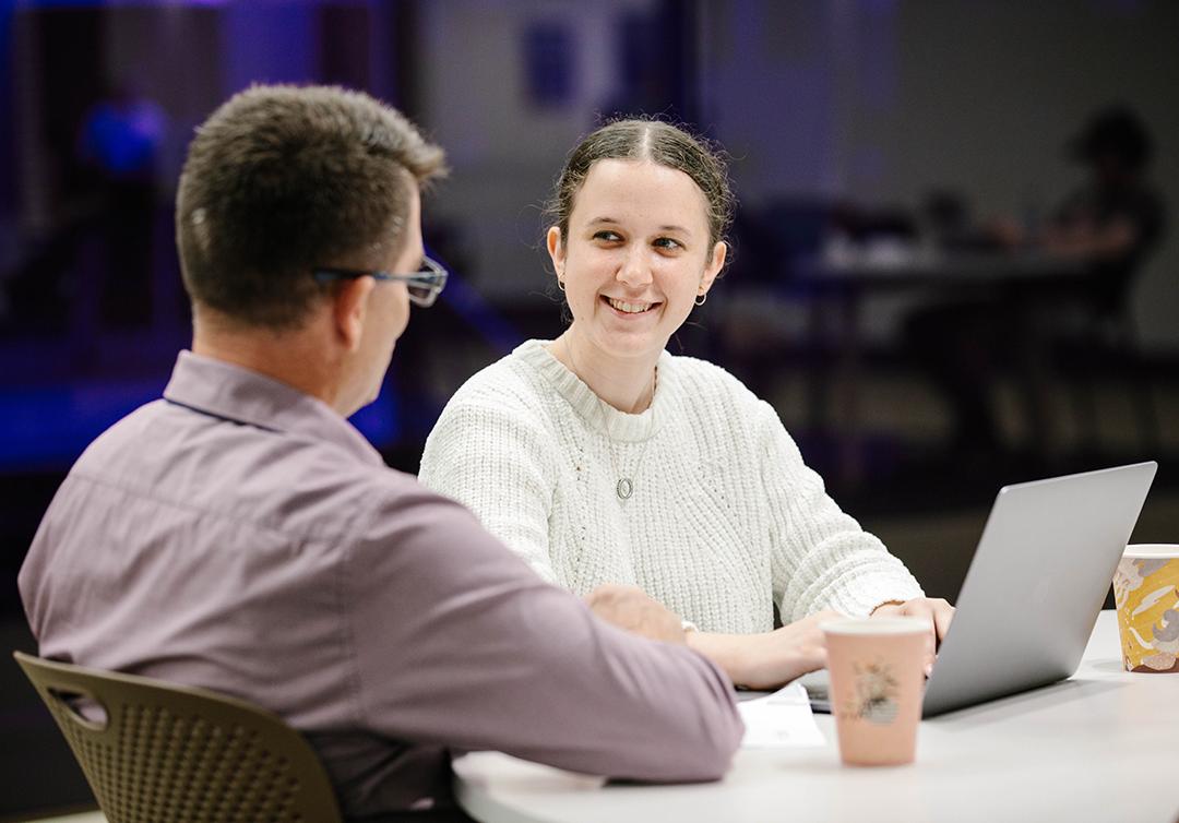 Two people talking