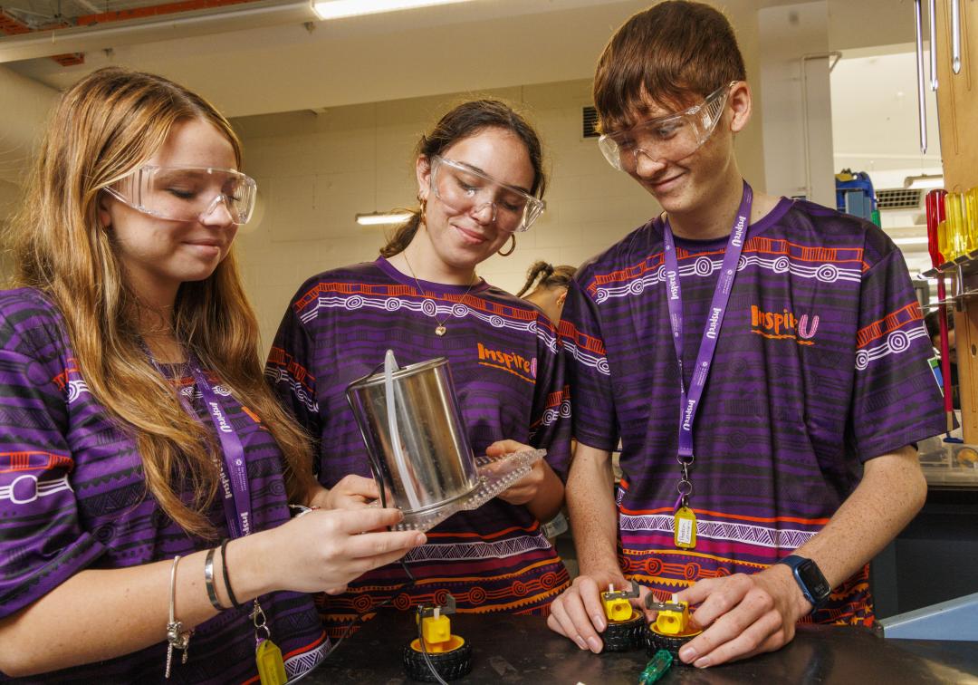 3 high school students participating in STEM activity at InspireU Camp 