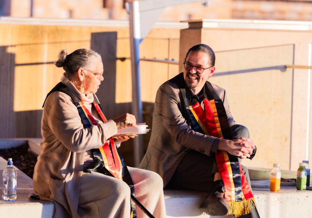 Two graduates at the 2025 mid-year Aboriginal and Torres Strait Islander sashing ceremony