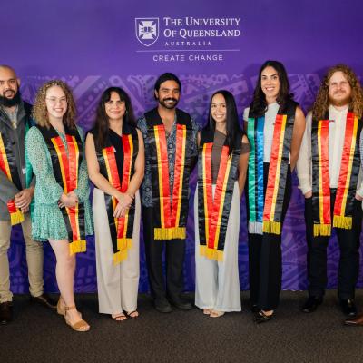 Nine graduands pose with Aboriginal and Torres Strait Islander sashes