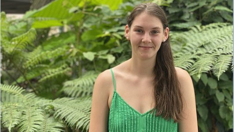 Miah Hickman smiling in front of garden