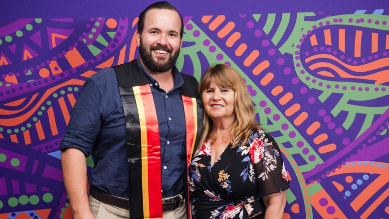 Dr Andrew Goodman at a recent UQ Indigenous Sashing Ceremony, with Robyn Donnelly from the Aboriginal and Torres Strait Islander Studies Unit (ATSISU).