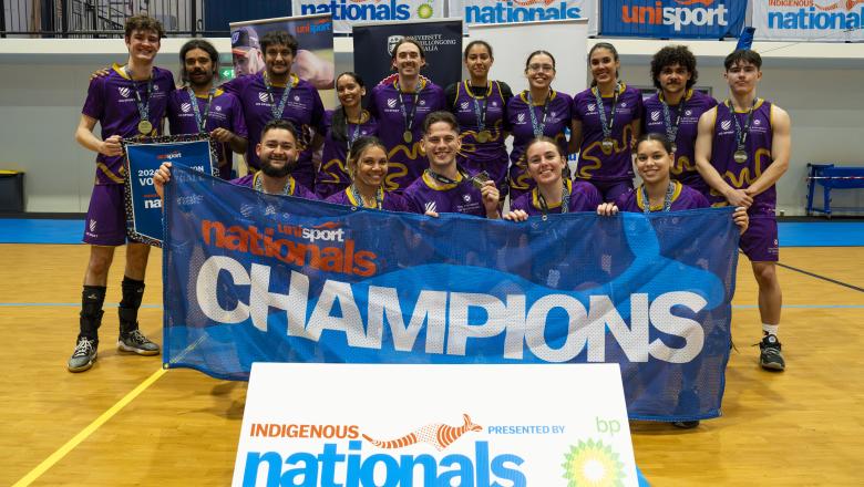 Team posing for volleyball championship photo