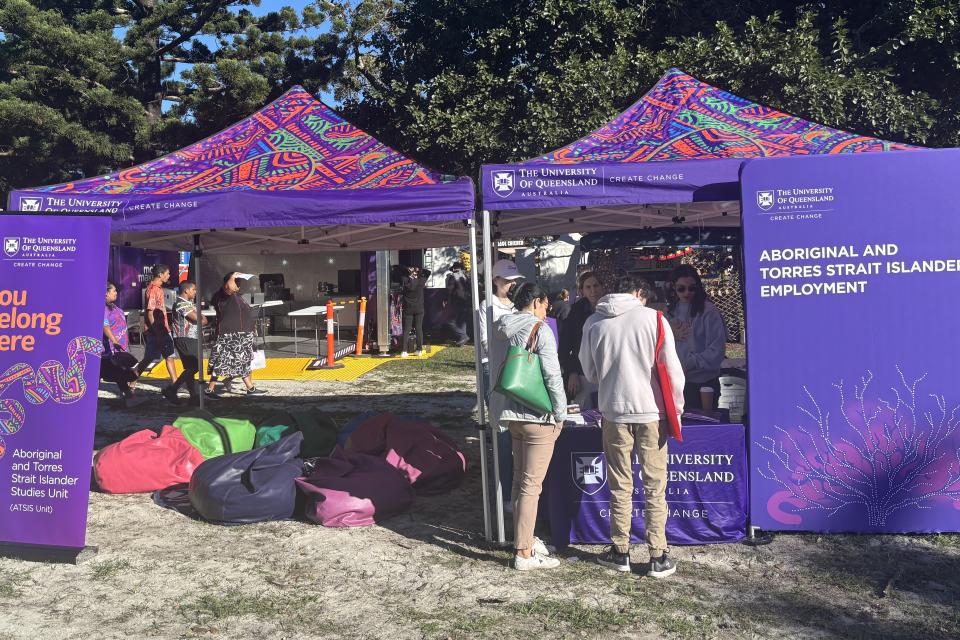 UQ staff connect with community members at the Musgrave Park Family Fun Day, sharing information about study pathways, research, and reconciliation initiatives as part of NAIDOC Week celebrations.