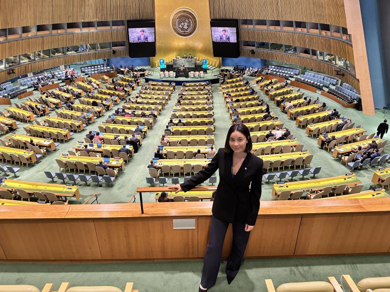 Young woman standing at the United Nations Headquarters in New York