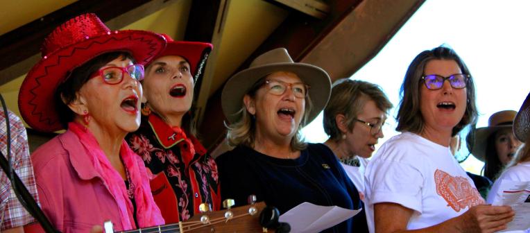 Voices of Reconciliation Choir and Deputy Vice-Chancellor (Indigenous Engagement) Professor Bronwyn Fredericks singing Solid Rock by Goanna for Professor Anita Heiss' book launch