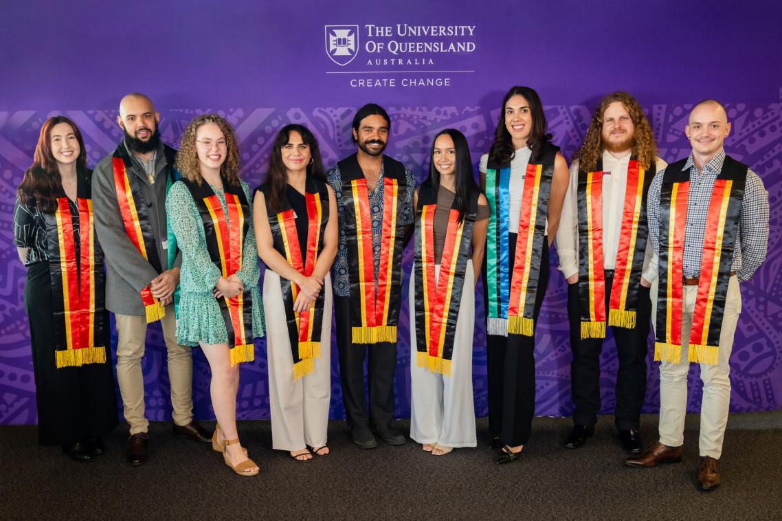 Nine graduands pose with Aboriginal and Torres Strait Islander sashes