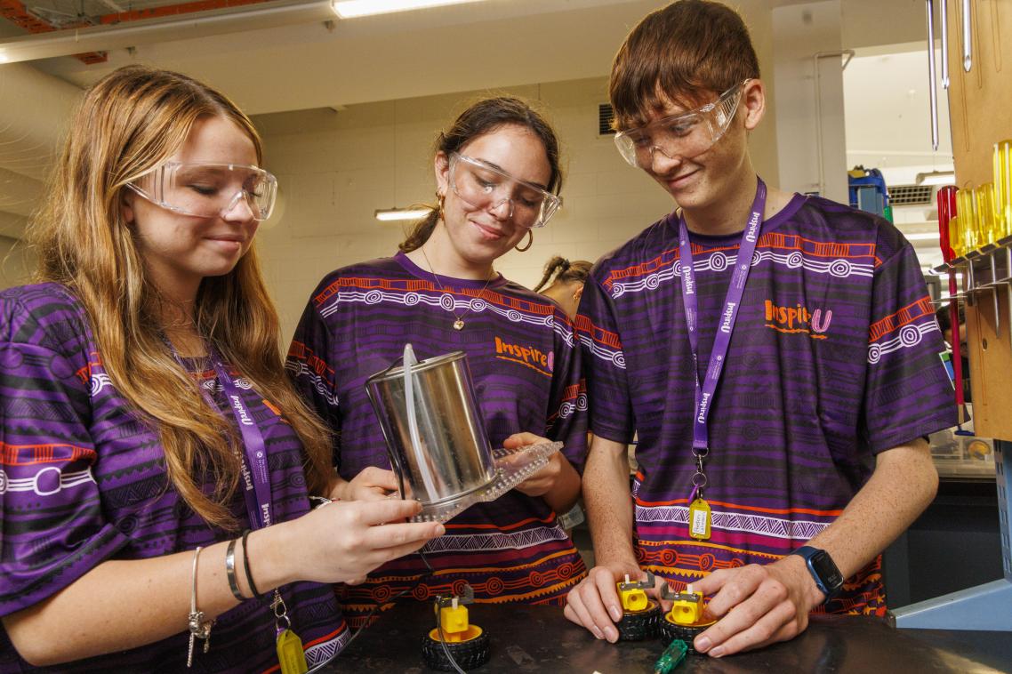 3 high school students participating in STEM activity at InspireU Camp 