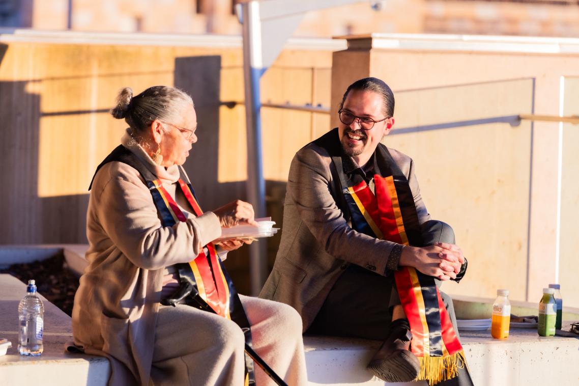 Two graduates at the 2025 mid-year Aboriginal and Torres Strait Islander sashing ceremony